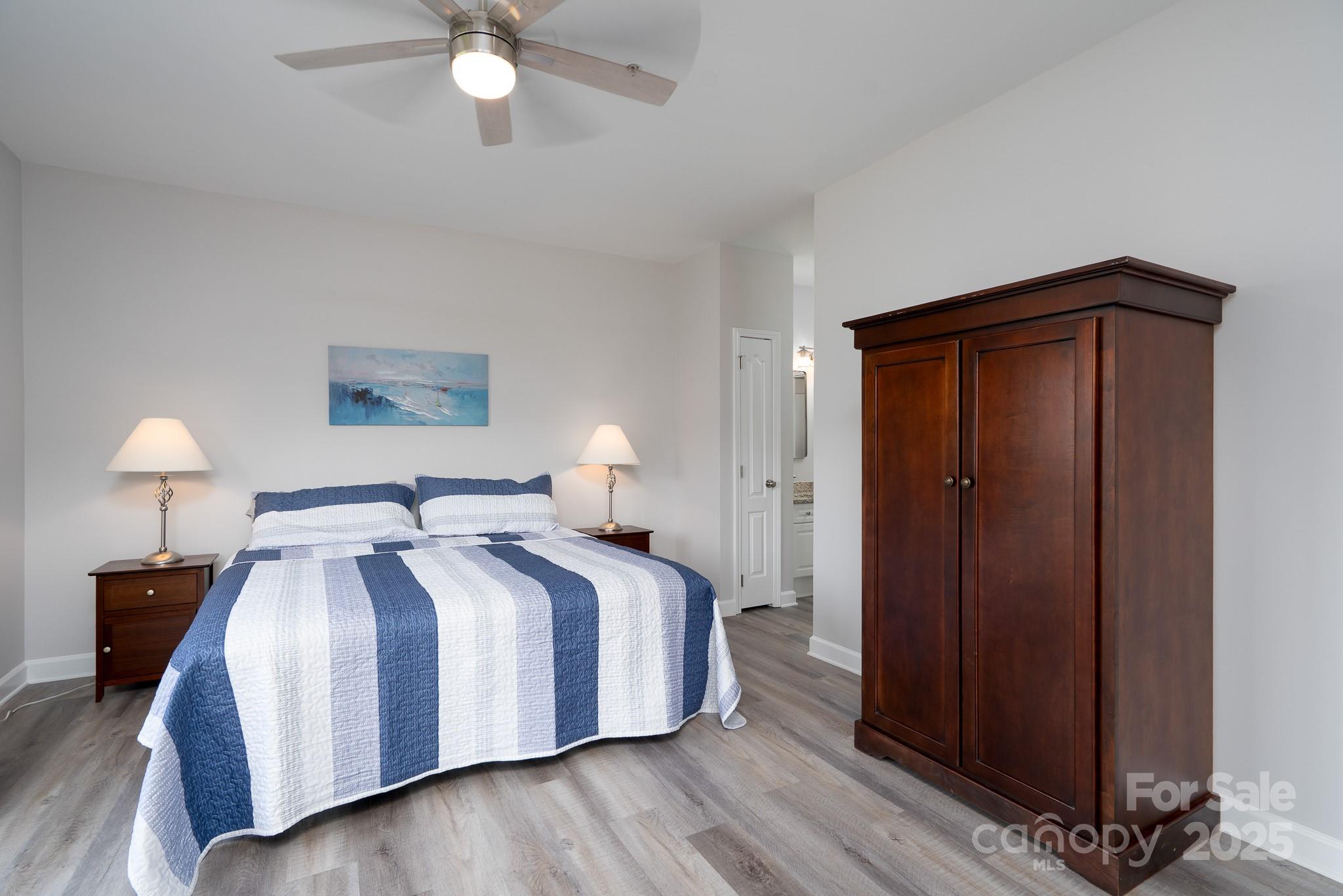 18511 Harborside Drive Cornelius, NC 28031 - Photo 13 of 27 a bedroom with a bed and a lamp