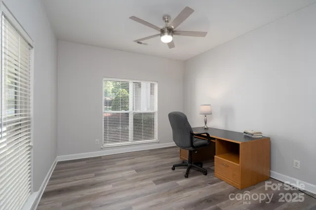 a workspace with furniture and a window
