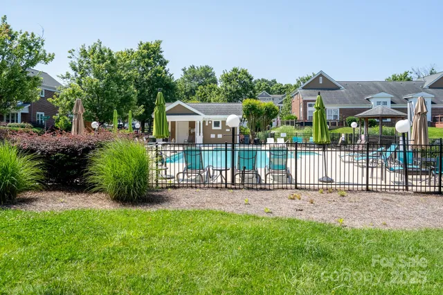 a view of a house with a small yard and plants