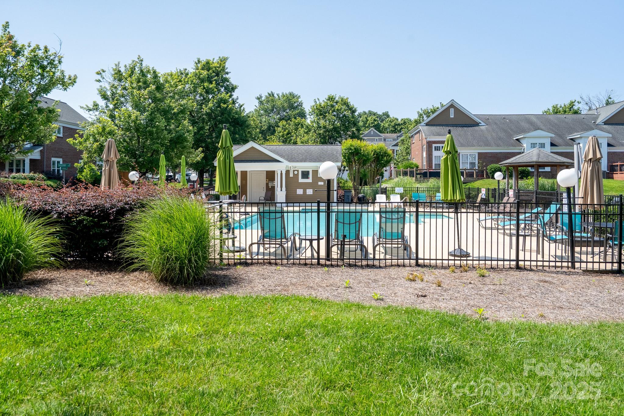 18511 Harborside Drive Cornelius, NC 28031 - Photo 20 of 27 a view of a house with a small yard and plants