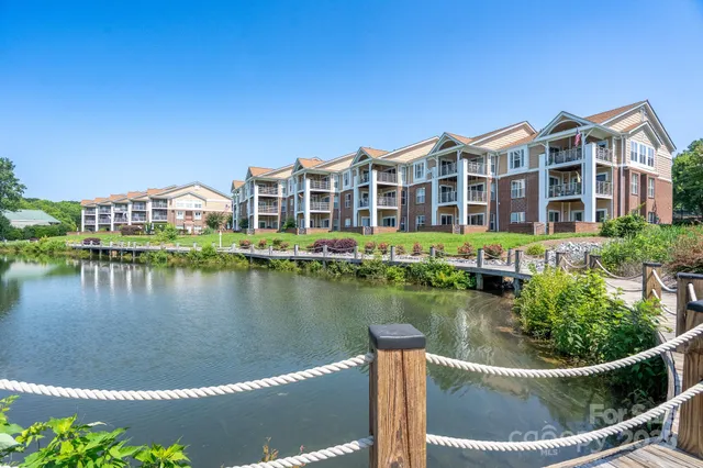 a view of a lake with a building in the background