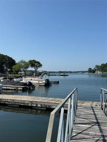 a view of a lake with houses in the background