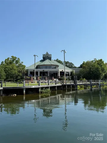 a view of a lake with houses in the back
