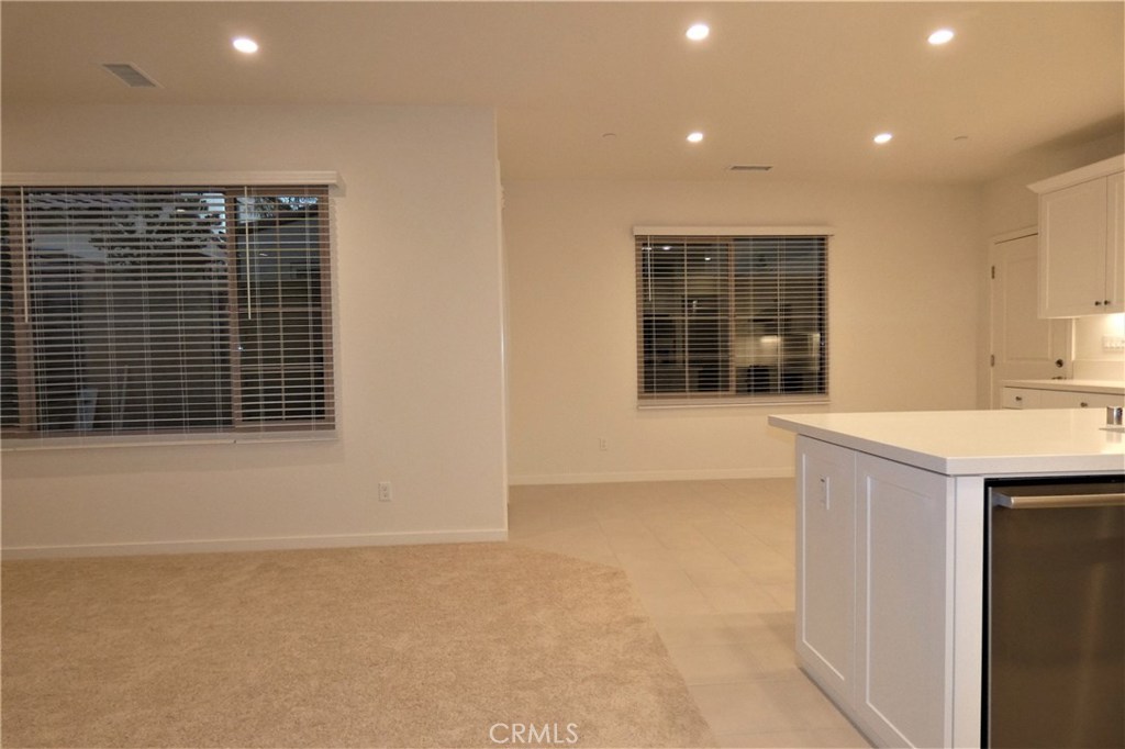 142 Anthology Irvine, CA 92618 - Photo 9 of 40 a kitchen with a sink and cabinets