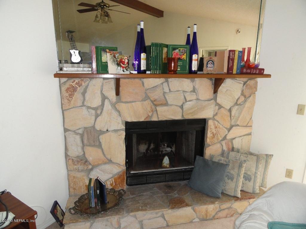 1643 Derringer Road Jacksonville, FL 32225 - Photo 14 of 21 a living room with furniture and a fireplace