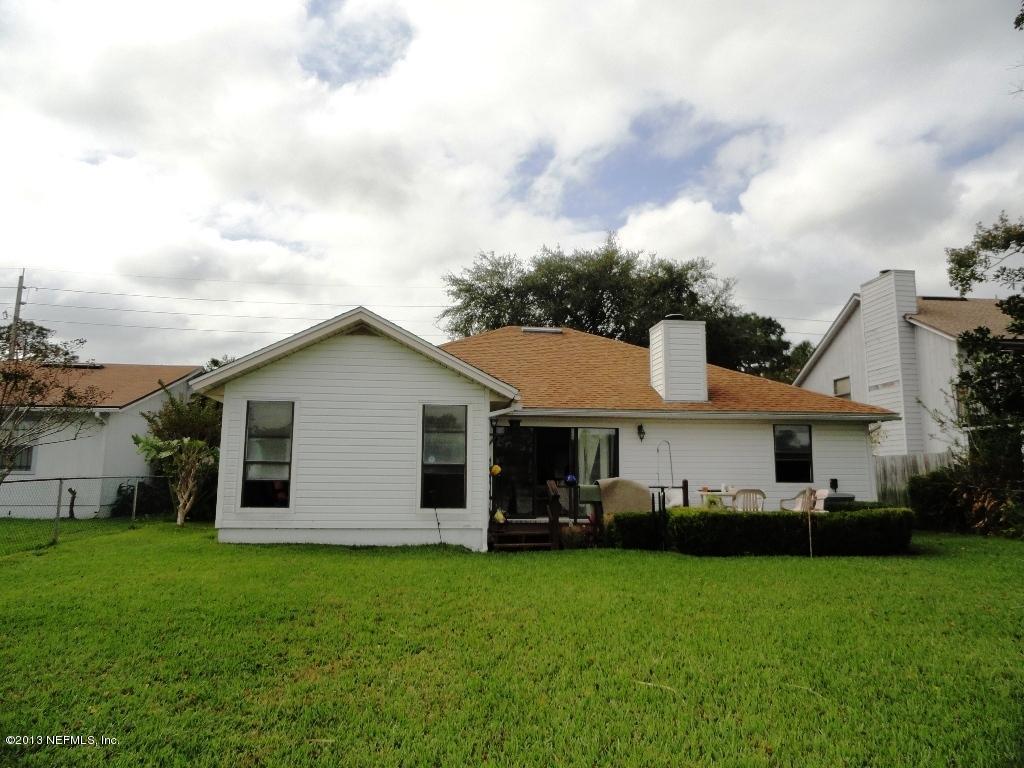 1643 Derringer Road Jacksonville, FL 32225 - Photo 15 of 21 a view of a yard in front of a house