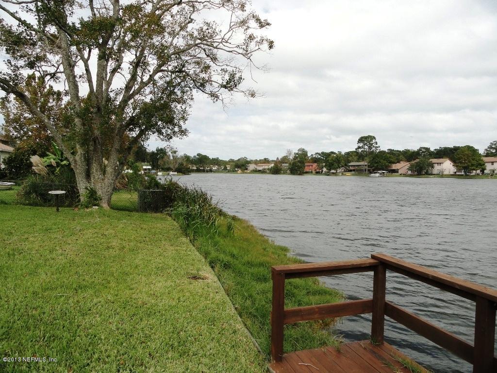 1643 Derringer Road Jacksonville, FL 32225 - Photo 16 of 21 a view of a lake with outdoor space