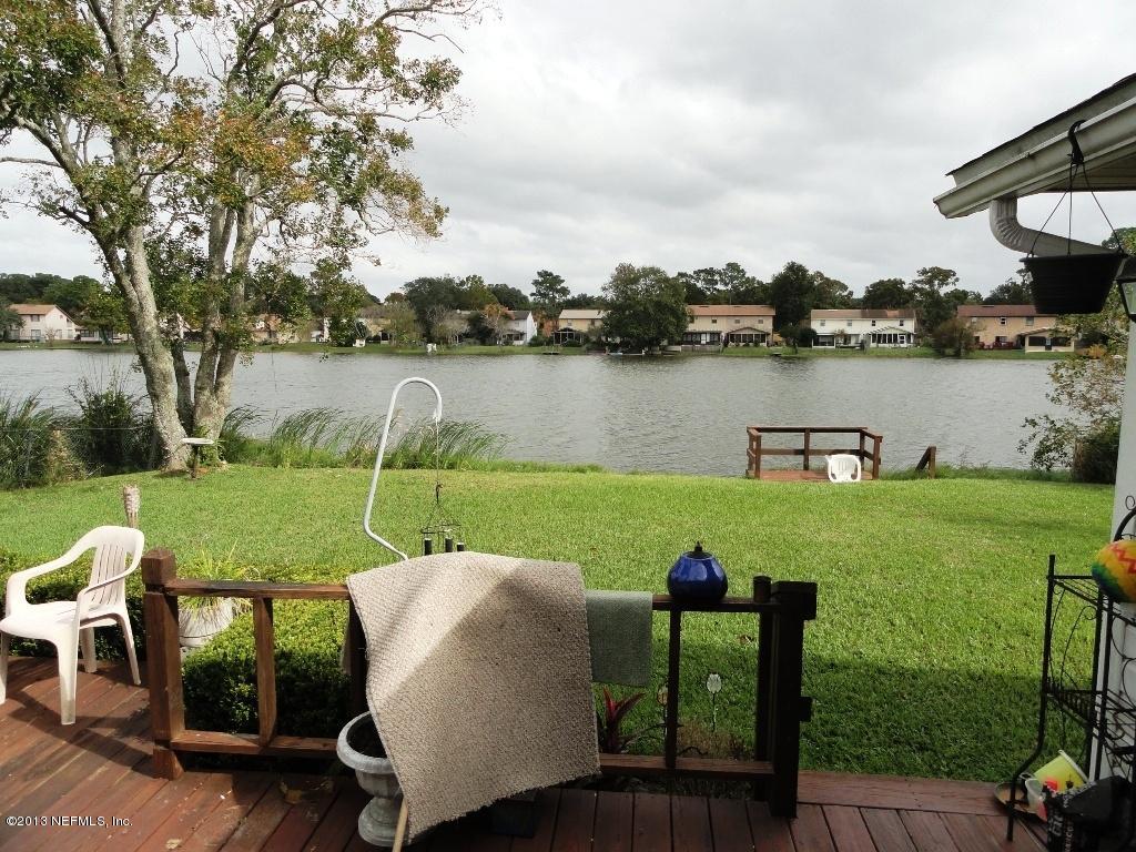 1643 Derringer Road Jacksonville, FL 32225 - Photo 19 of 21 a view of a lake with houses