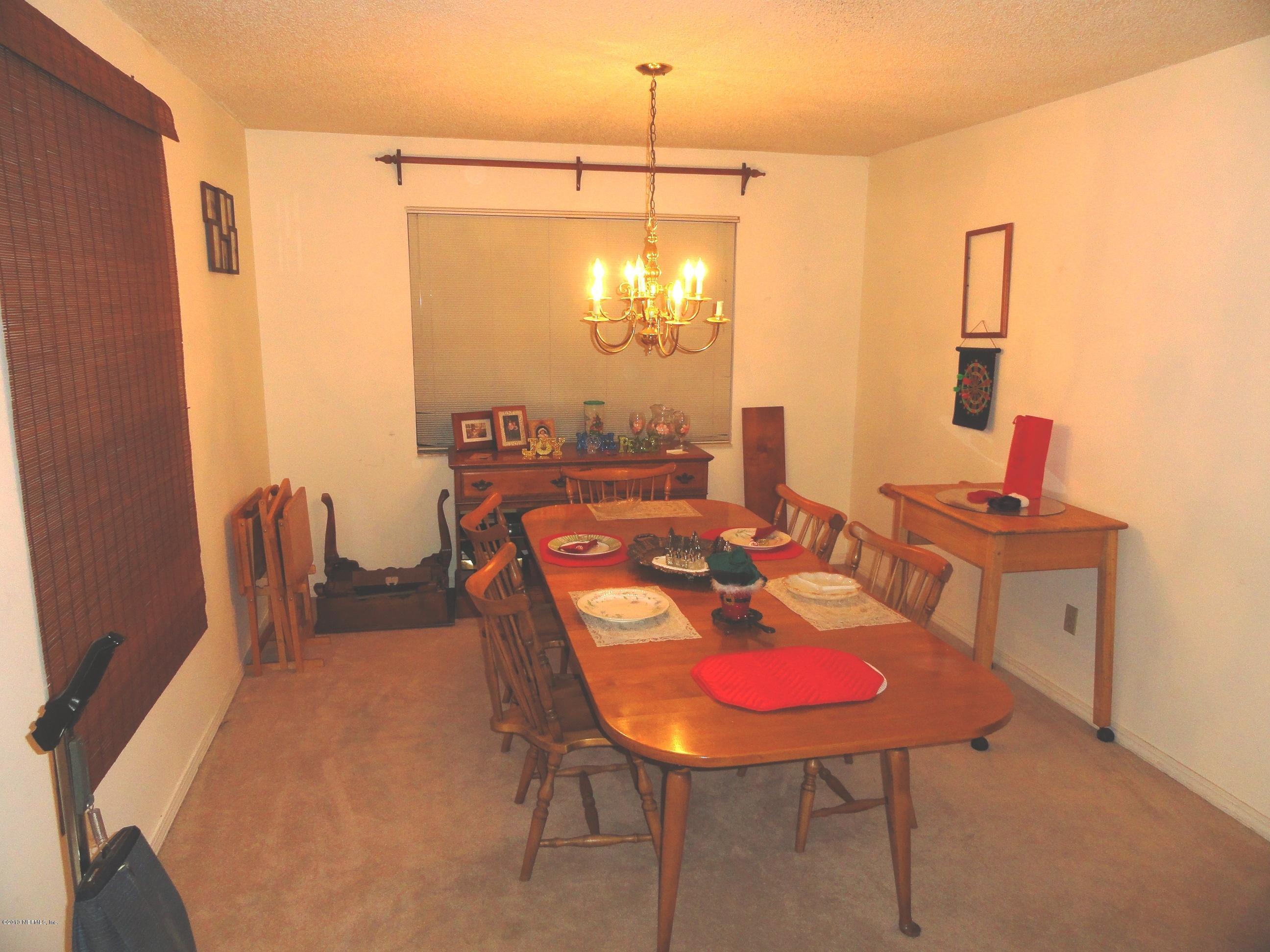 1643 Derringer Road Jacksonville, FL 32225 - Photo 4 of 21 a dining room with furniture and window
