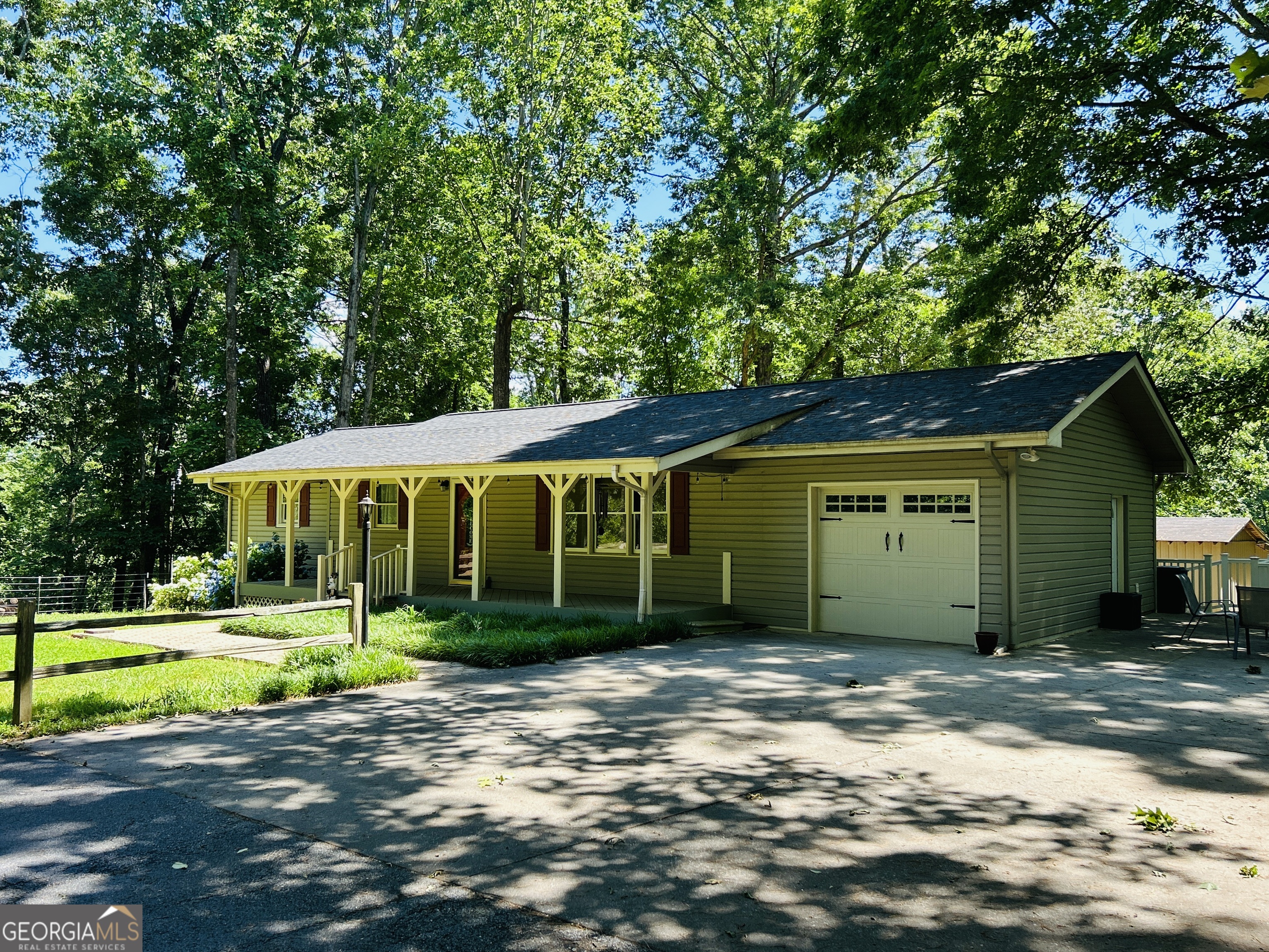 303 Chitwood Road Clarkesville, GA 30523 - Photo 1 of 1 a view of a big house with a big yard and large trees