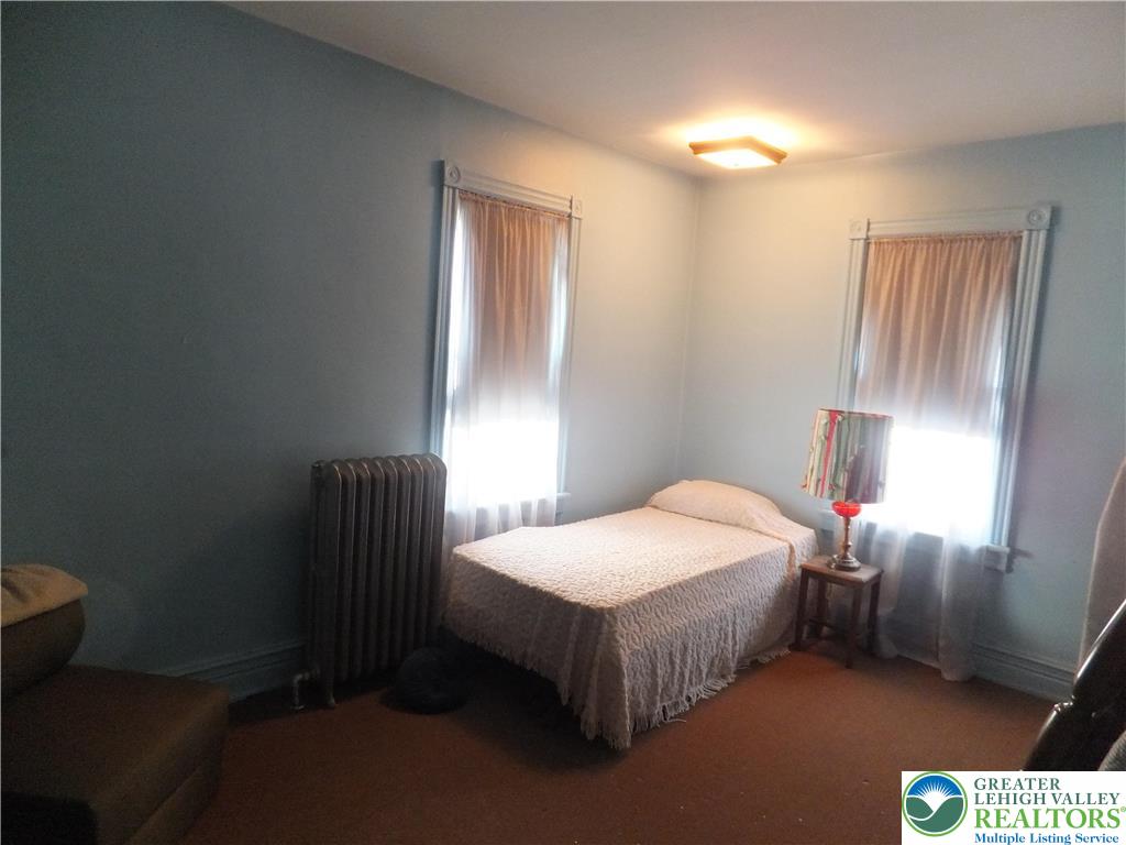 9 North 4th Street Coplay, PA 18037 - Photo 12 of 17 a bedroom with a bed and a window