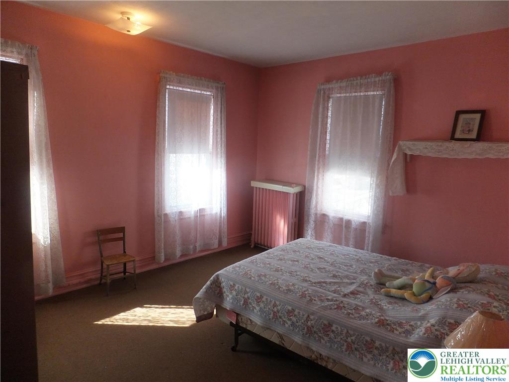 9 North 4th Street Coplay, PA 18037 - Photo 13 of 17 a bedroom with a bed and a window