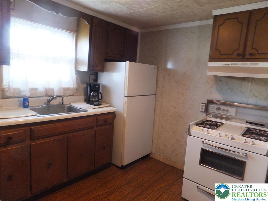 9 North 4th Street Coplay, PA 18037 - Photo 7 of 17 a kitchen with a refrigerator stove and sink