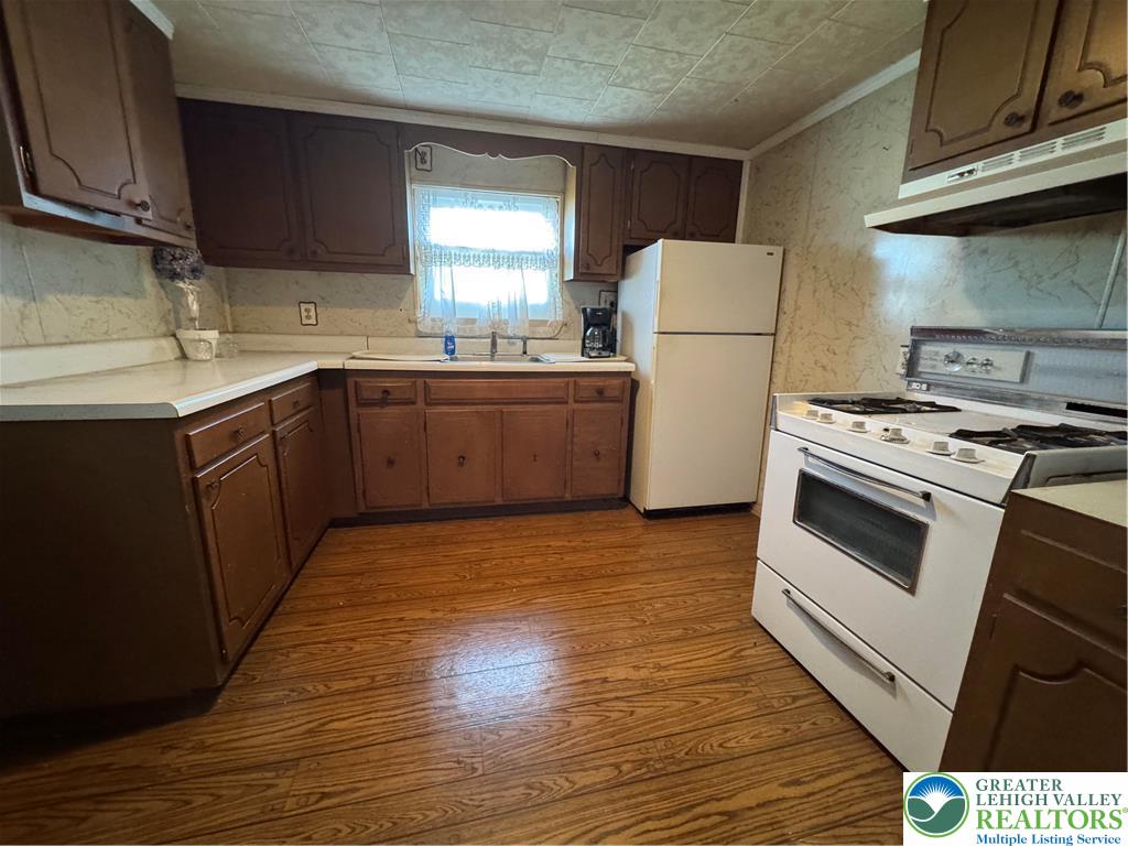9 North 4th Street Coplay, PA 18037 - Photo 8 of 17 a kitchen with a stove a refrigerator and a sink