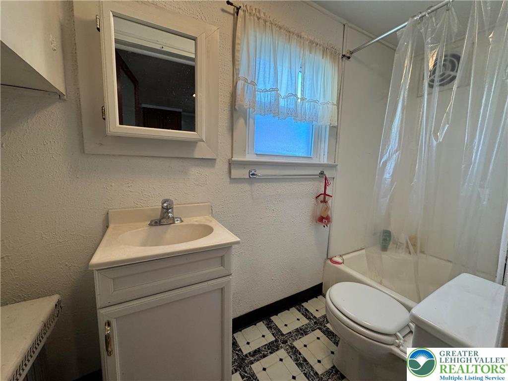 9 North 4th Street Coplay, PA 18037 - Photo 10 of 17 a bathroom with a sink toilet and shower