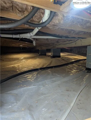 a view of room with wooden floor