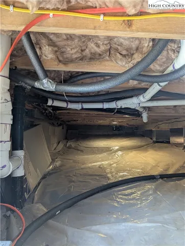 a view of backyard of house with green space