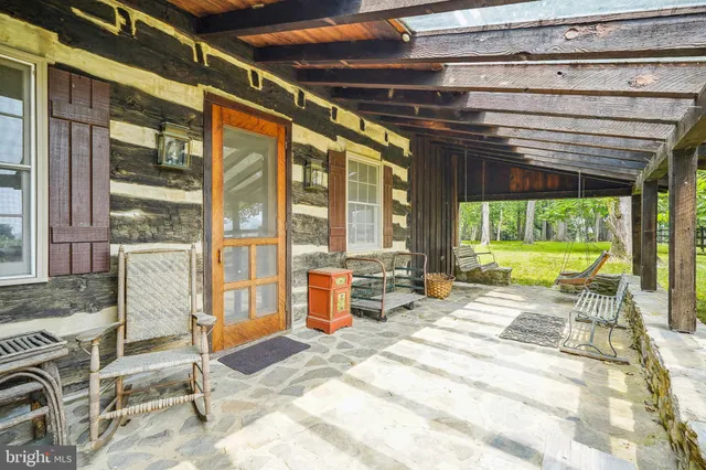 a view of swimming pool with seating area and furniture