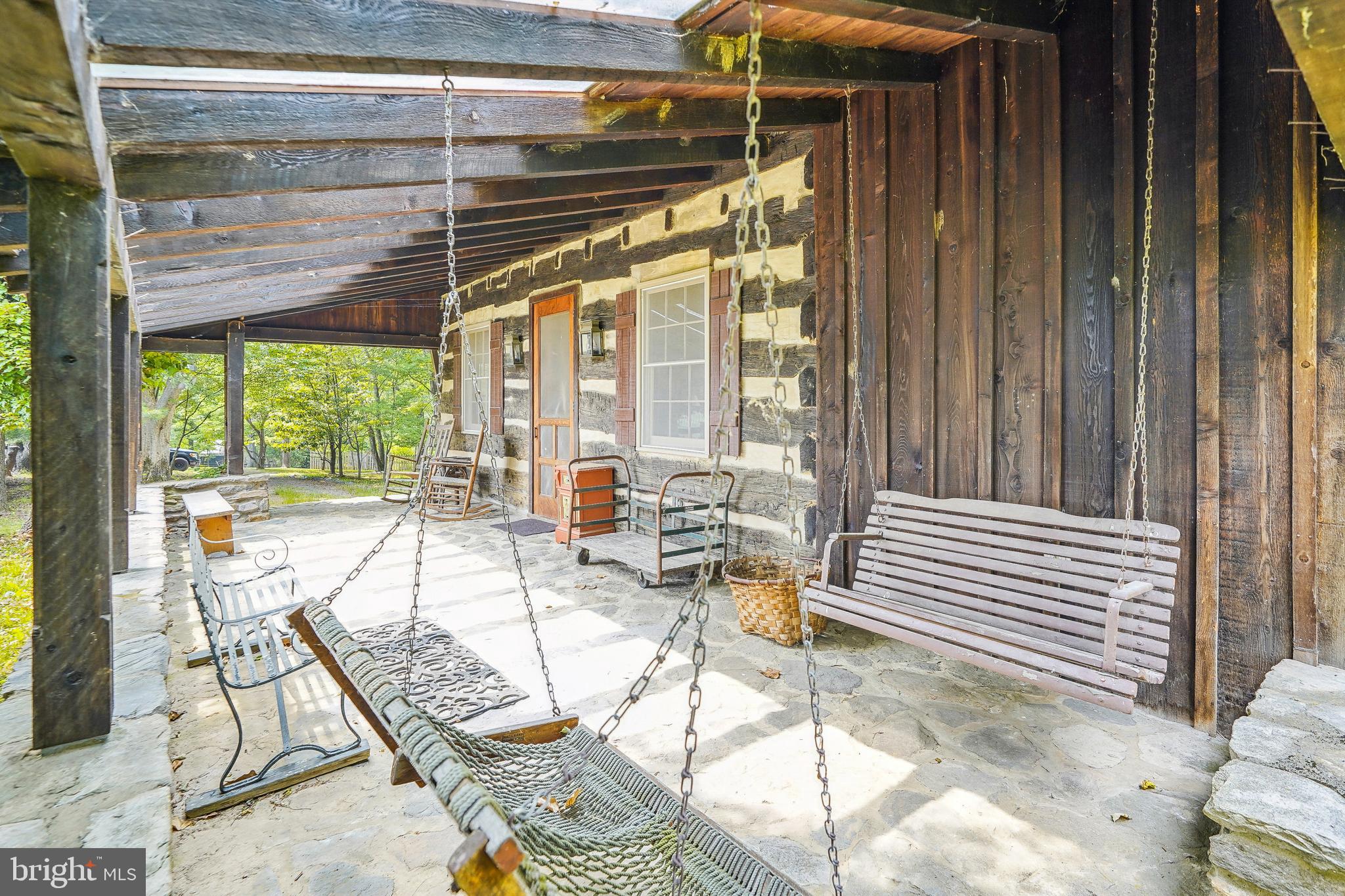 18285 Foundry Road Purcellville, VA 20132 - Photo 2 of 53 a view of a patio with a dining table and chairs