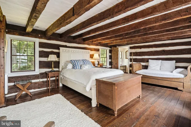 a bedroom with a bed and furniture