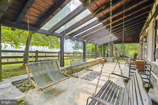 a view of swimming pool with a patio