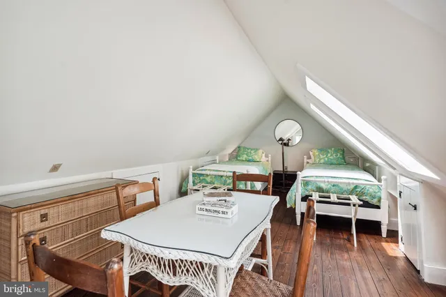 a room that has a bed and a window in it