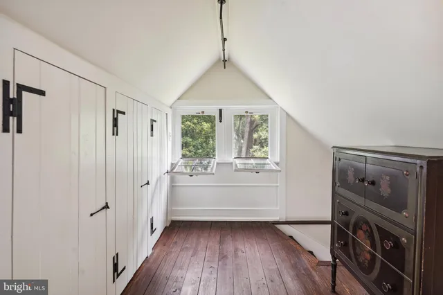 a view of a park with large trees