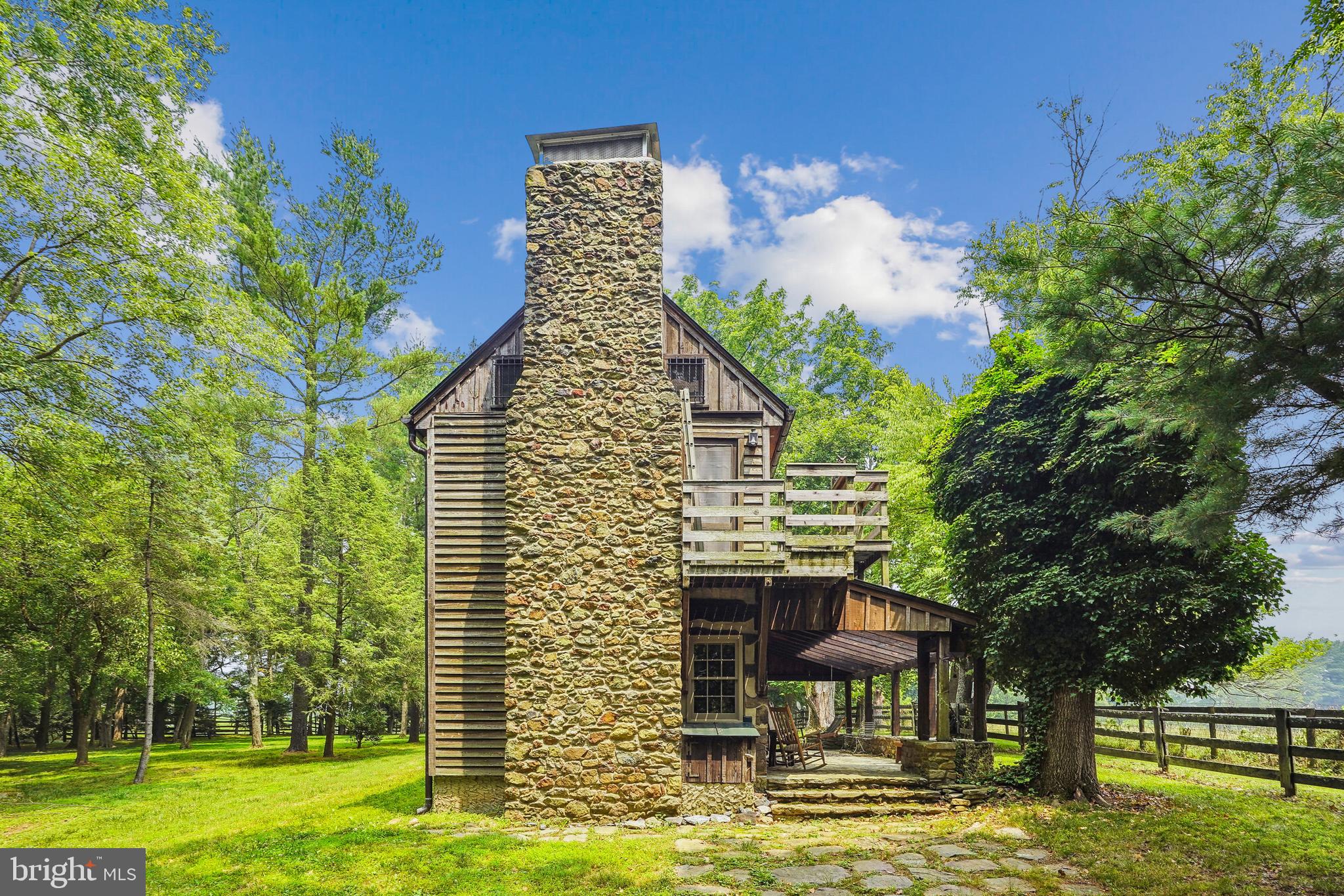 18285 Foundry Road Purcellville, VA 20132 - Photo 44 of 53 a backyard of a house with table and chairs