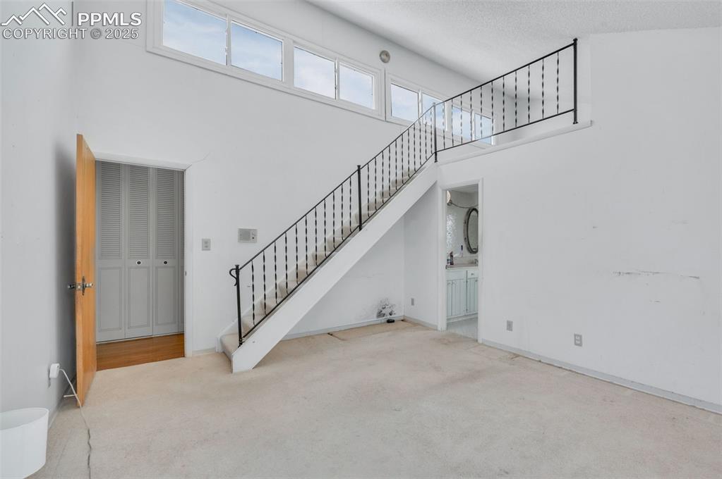 24975 Sanborn Road Calhan, CO 80808 - Photo 20 of 50 a view of staircase with white walls and white walls