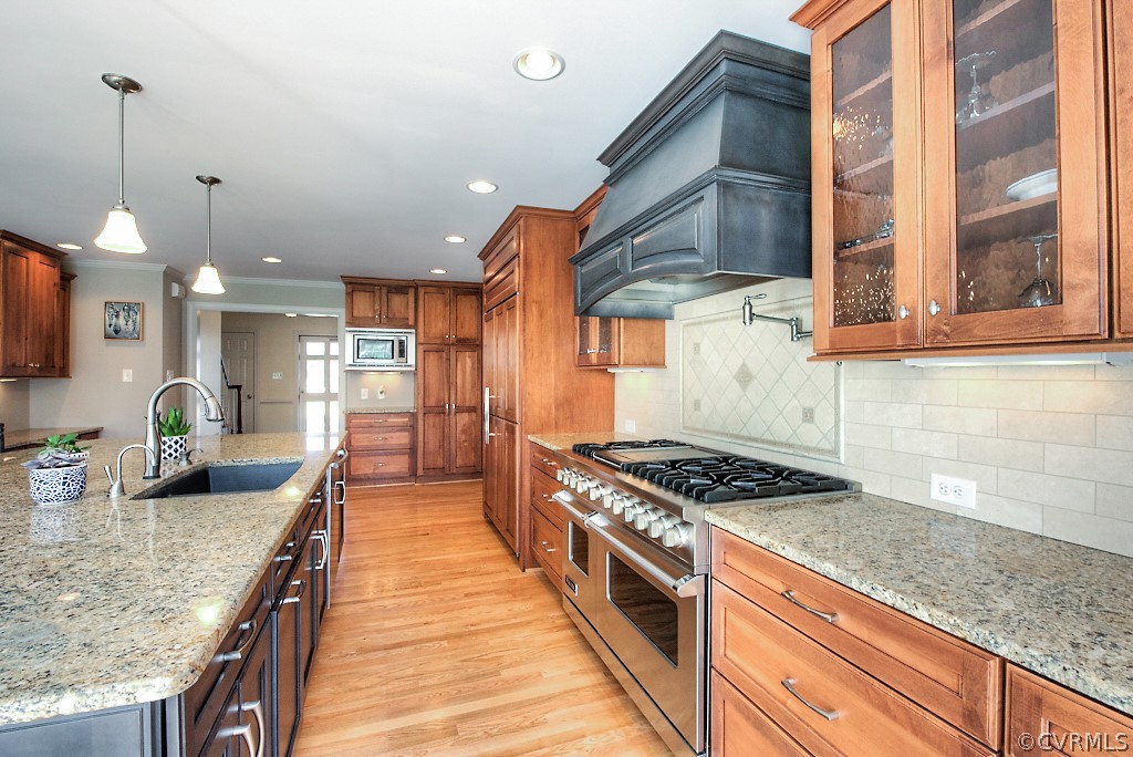 2252 Banstead Road Midlothian, VA 23113 - Photo 24 of 50 a kitchen with stainless steel appliances granite countertop a sink a stove and a wooden floors