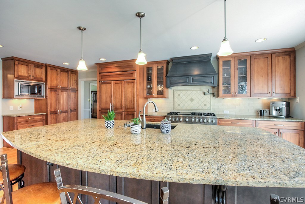 2252 Banstead Road Midlothian, VA 23113 - Photo 27 of 50 a kitchen with sink refrigerator and stove