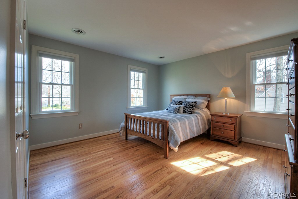 2252 Banstead Road Midlothian, VA 23113 - Photo 31 of 50 a spacious bedroom with a bed and wooden floor