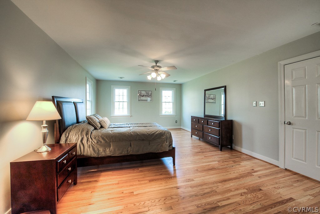 2252 Banstead Road Midlothian, VA 23113 - Photo 36 of 50 a bedroom with a bed and wooden floor