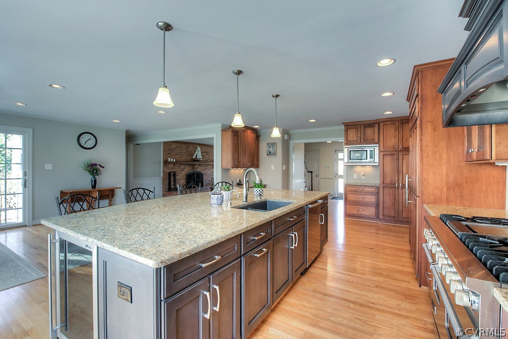 2252 Banstead Road Midlothian, VA 23113 - Photo 50 of 50 a kitchen with stainless steel appliances granite countertop a sink a stove and a wooden floors