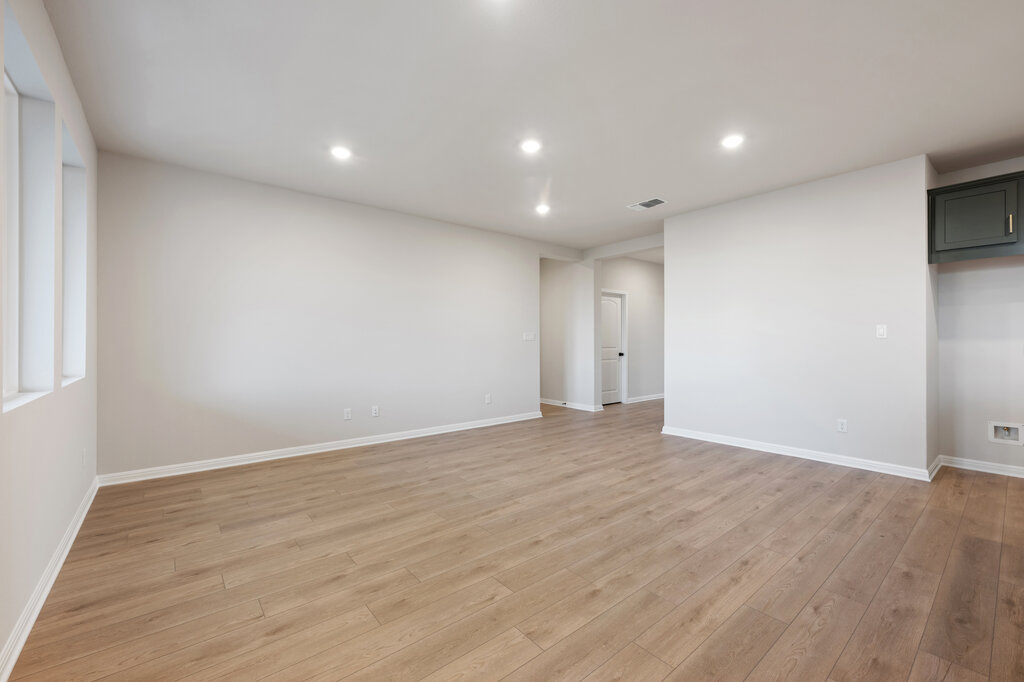 2509 Walking Y Road Georgetown, TX 78633 - Photo 14 of 40 a view of an empty room with wooden floor