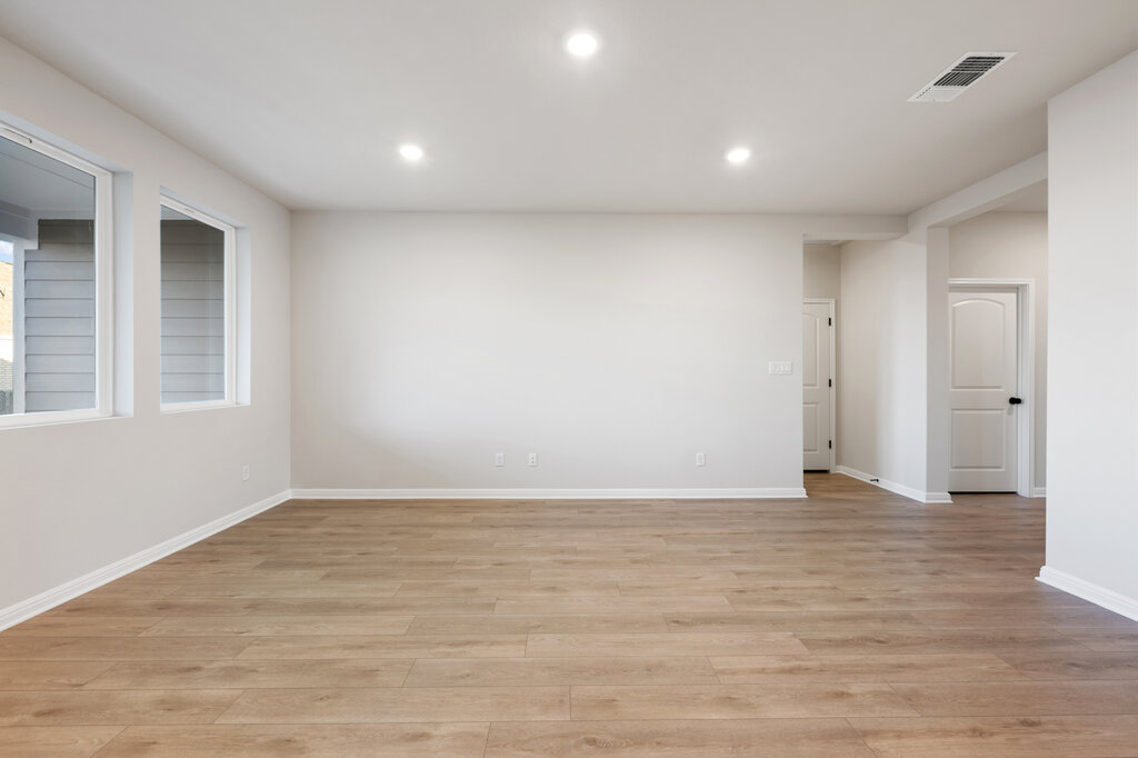2509 Walking Y Road Georgetown, TX 78633 - Photo 15 of 40 a view of an empty room with wooden floor and a window