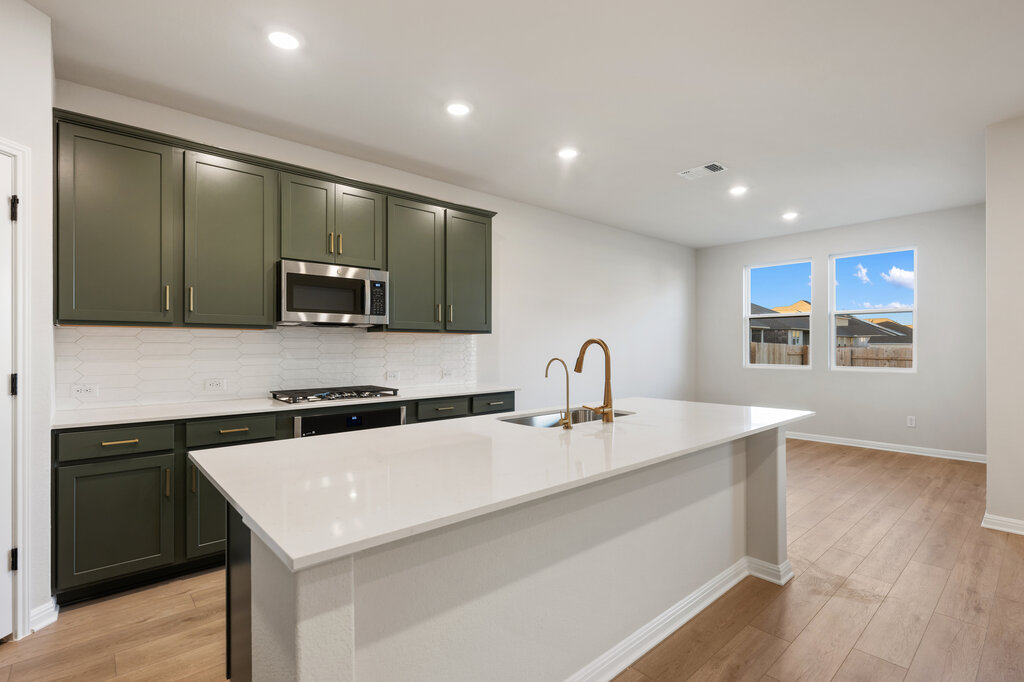 2509 Walking Y Road Georgetown, TX 78633 - Photo 18 of 40 a kitchen with stainless steel appliances granite countertop a sink a microwave a stove and refrigerator