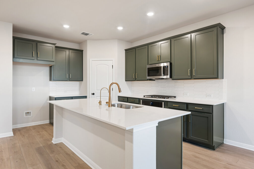 2509 Walking Y Road Georgetown, TX 78633 - Photo 19 of 40 a kitchen with stainless steel appliances granite countertop a sink stove and microwave