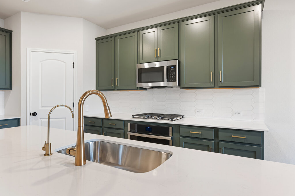2509 Walking Y Road Georgetown, TX 78633 - Photo 20 of 40 a kitchen with granite countertop a stove and a microwave