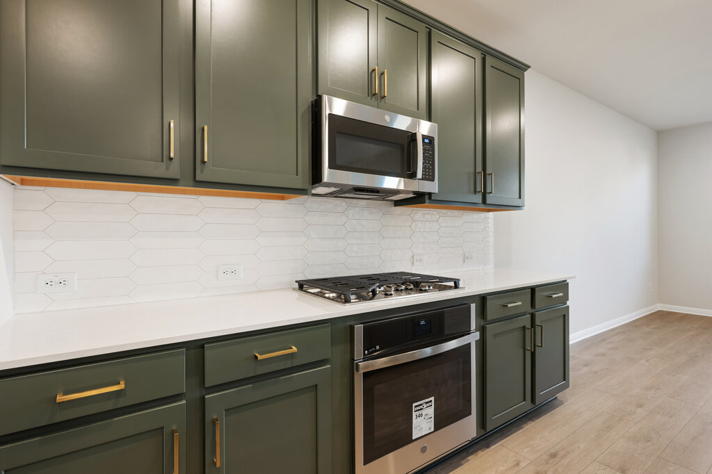 2509 Walking Y Road Georgetown, TX 78633 - Photo 23 of 40 a kitchen with stainless steel appliances granite countertop a sink and a stove top oven