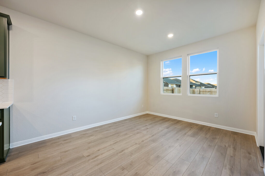 2509 Walking Y Road Georgetown, TX 78633 - Photo 27 of 40 a view of an empty room with wooden floor and a window