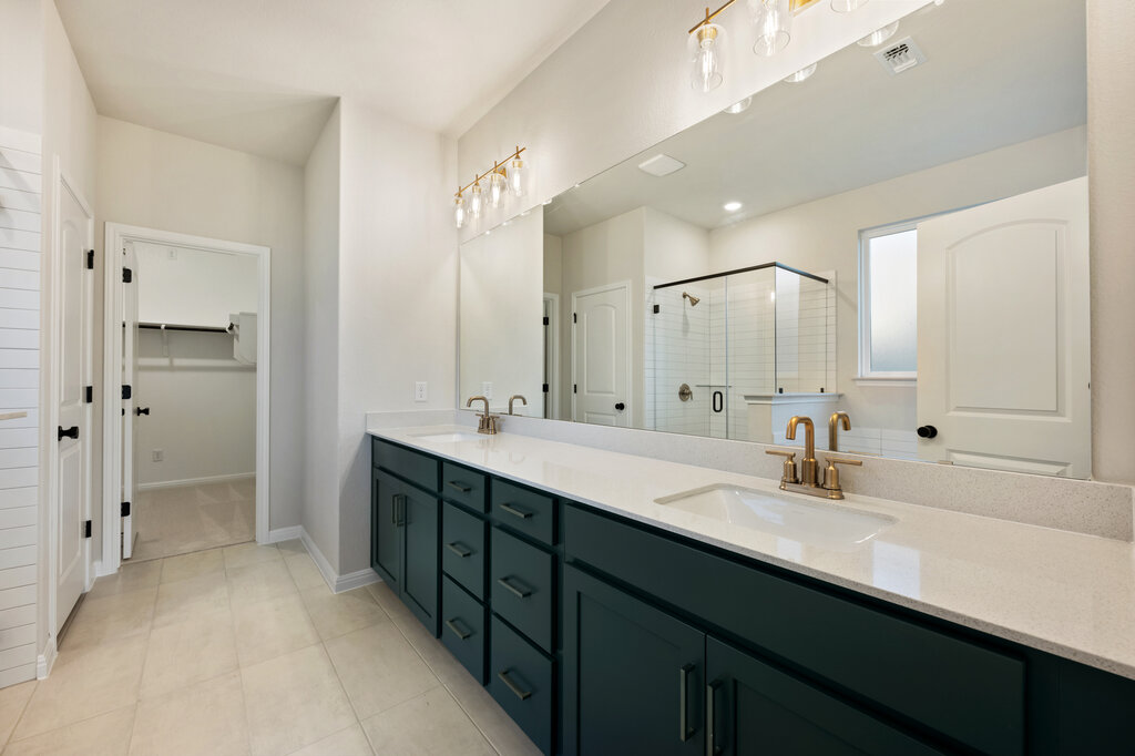 2509 Walking Y Road Georgetown, TX 78633 - Photo 32 of 40 a bathroom with a double vanity sink mirror double and shower