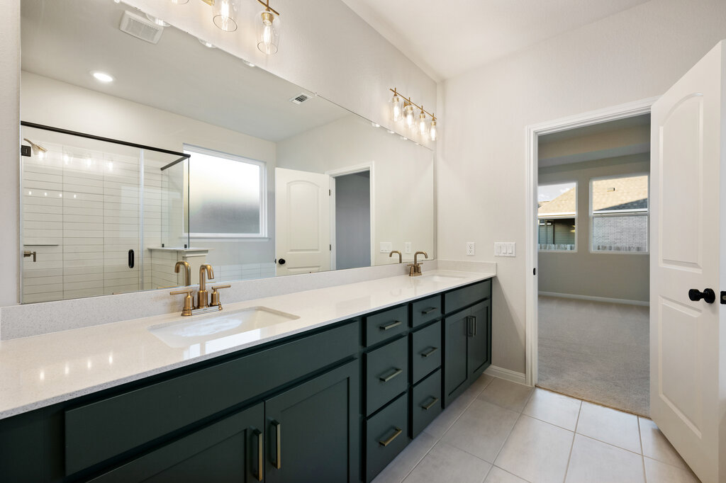 2509 Walking Y Road Georgetown, TX 78633 - Photo 34 of 40 a bathroom with a double vanity sink mirror and double