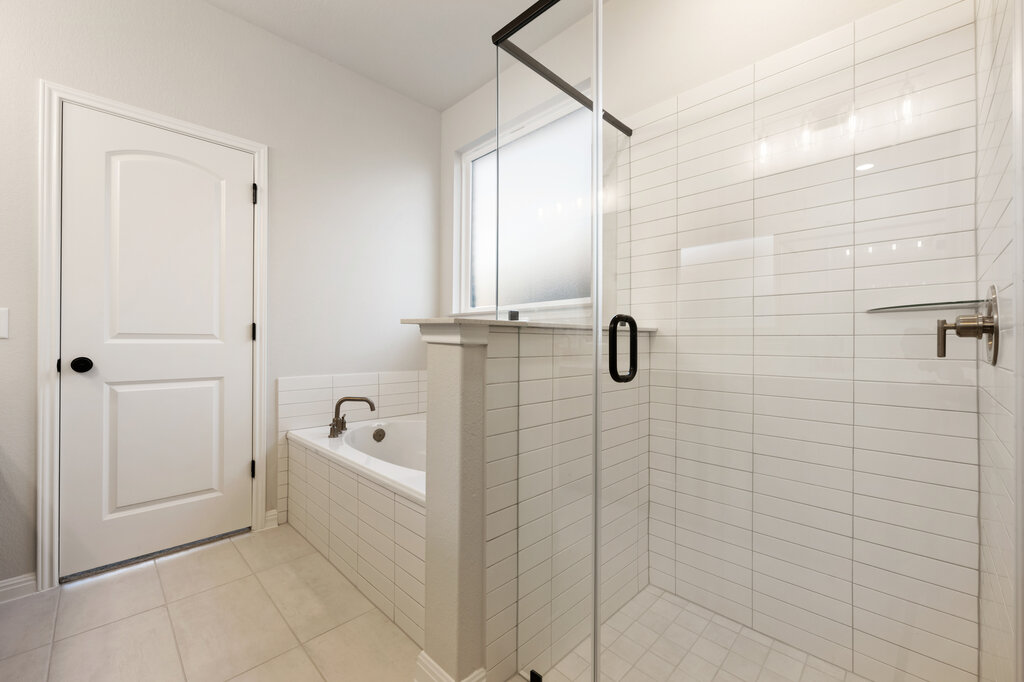 2509 Walking Y Road Georgetown, TX 78633 - Photo 35 of 40 a bathroom with a bathtub a shower a toilet and a sink