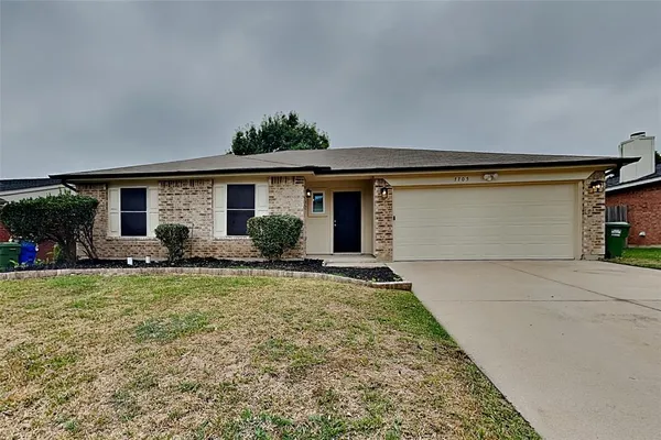 a front view of house with yard and outdoor seating