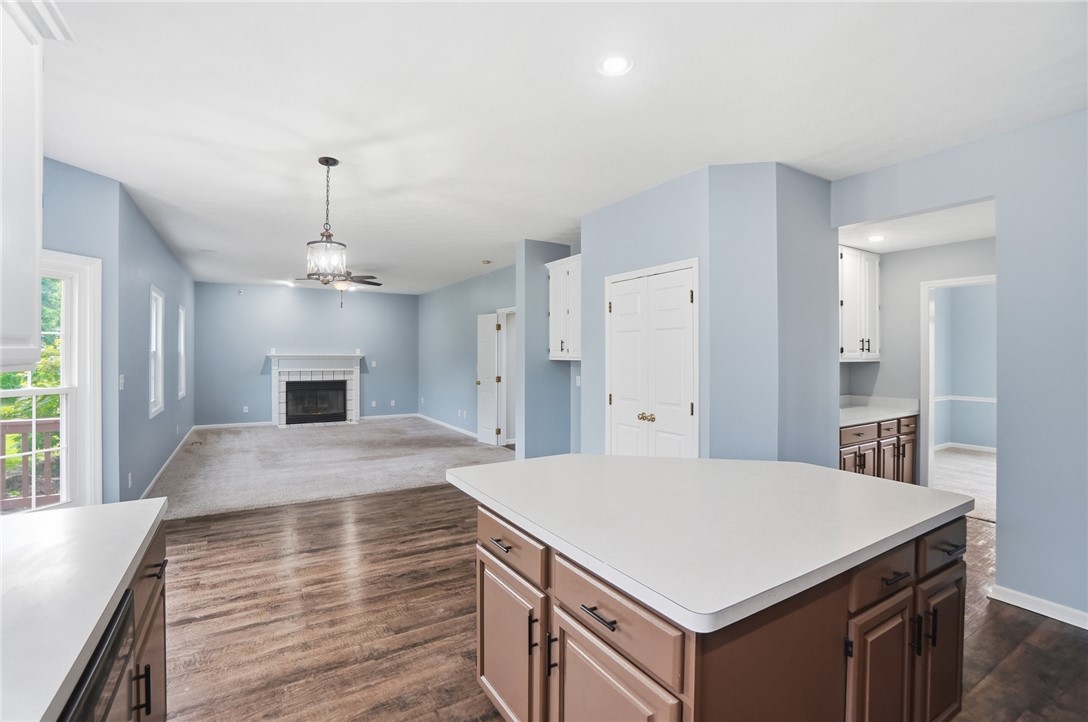 10 Chase Court Springboro, OH 45066 - Photo 24 of 75 An inviting open-concept living space features a cozy fireplace and convenient kitchen access.