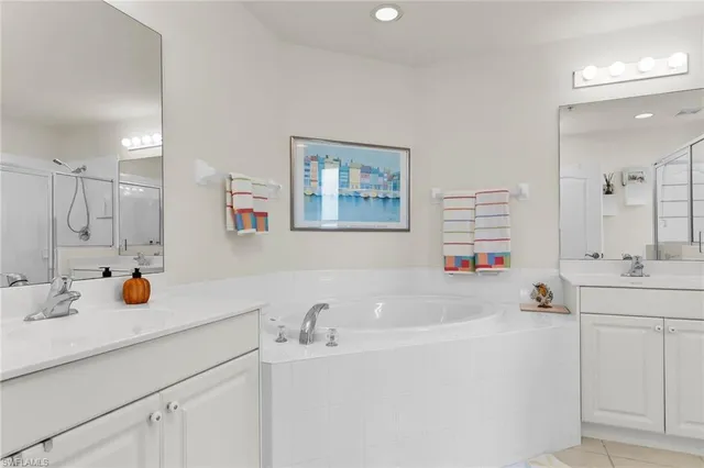 a bathroom with a shower sink and mirror