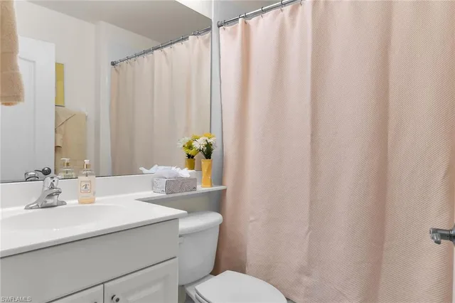 a view of storage and utility room with windows