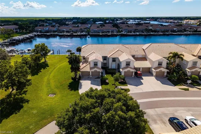 an aerial view of a house with garden space and outdoor seating