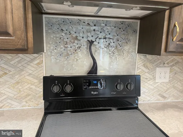 a kitchen with a sink and a window